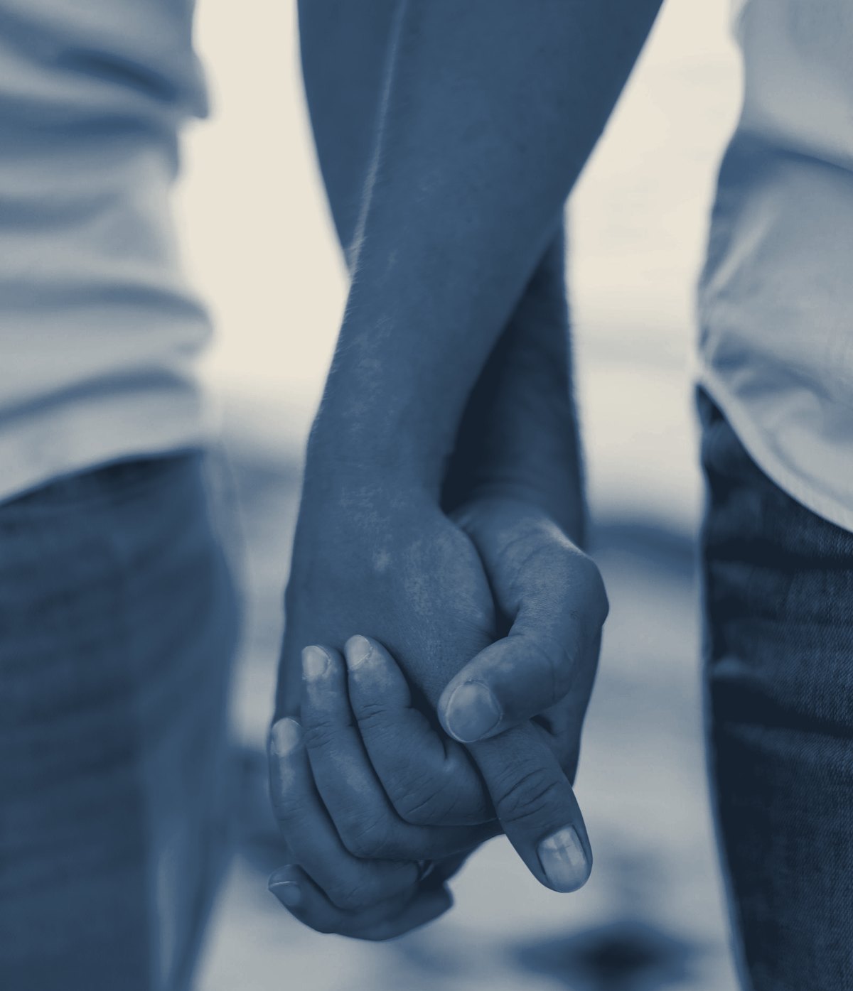 Two partners holding hands